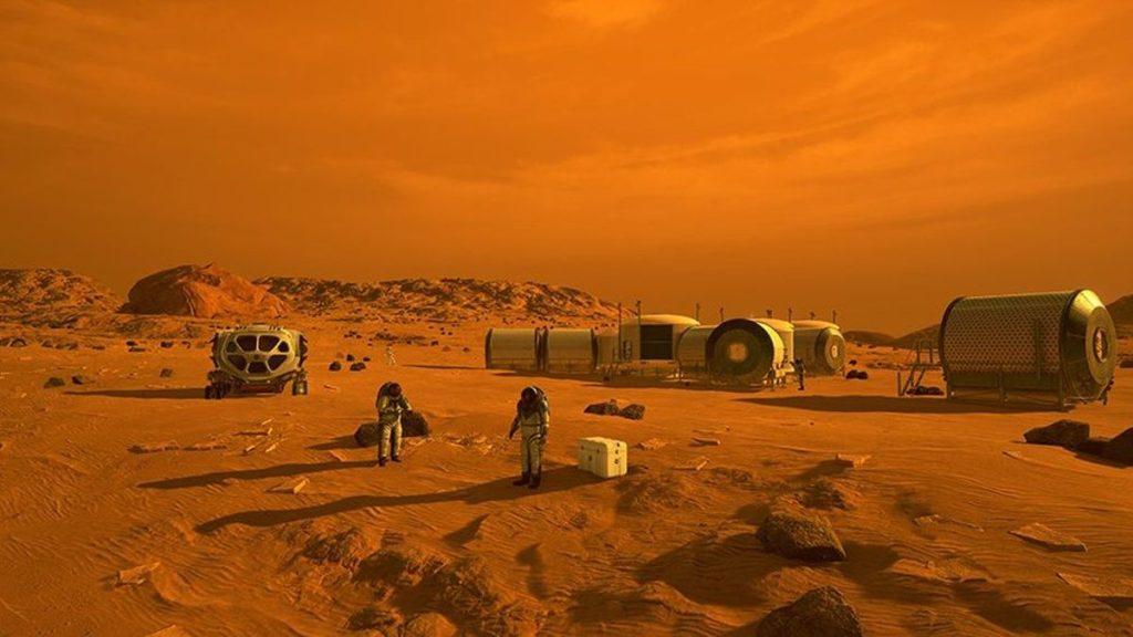 people in spacesuits on the surface of mars surrounded by metal buildings