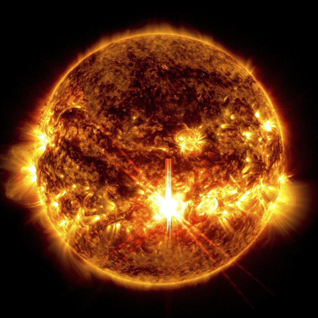 Gambar NASA yang diambil oleh Solar Dynamics Observatory ini menunjukkan jilatan api matahari, kilatan terang di tengah gambar, pada 3 Oktober 2024. (Solar Dynamics Observatory/NASA via AP, File)